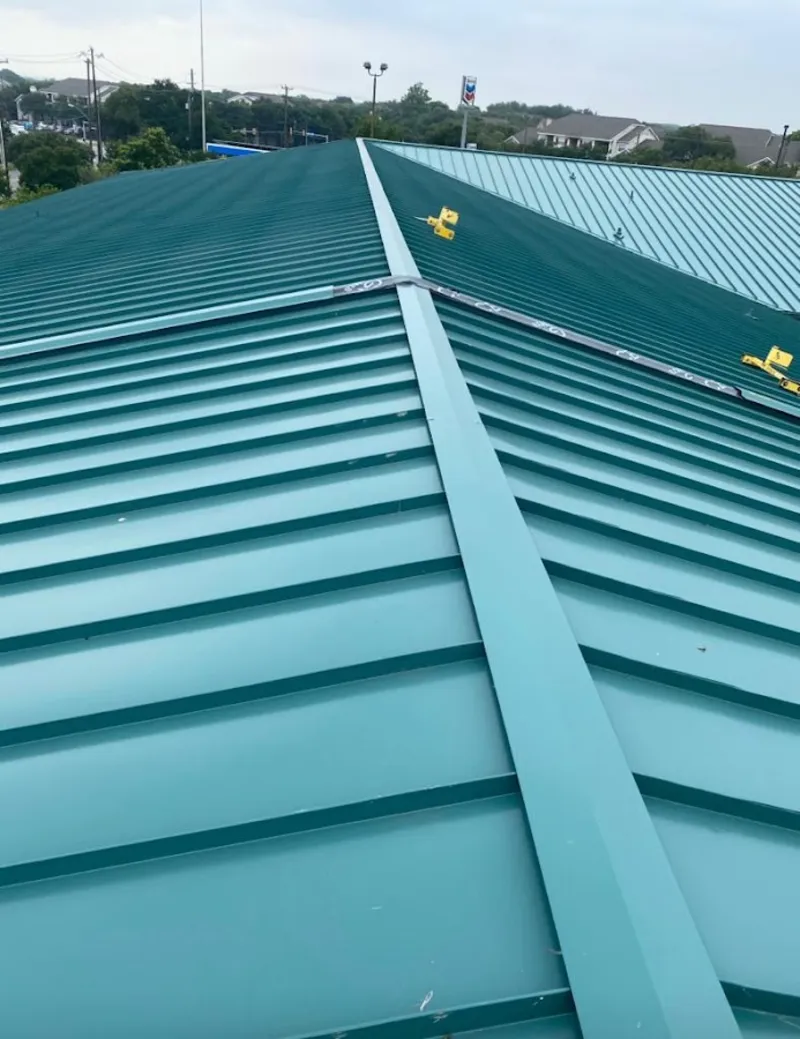 Green commercial metal roof ridge and valley for Metal Roof Repair in Noble